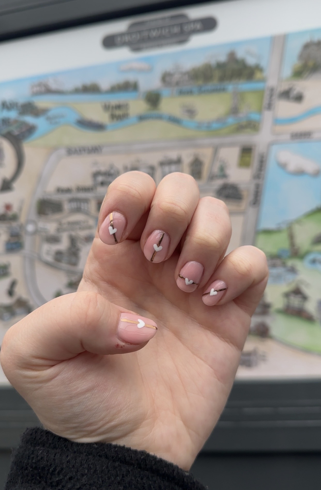 Pale nude nails with tiny hand-painted details