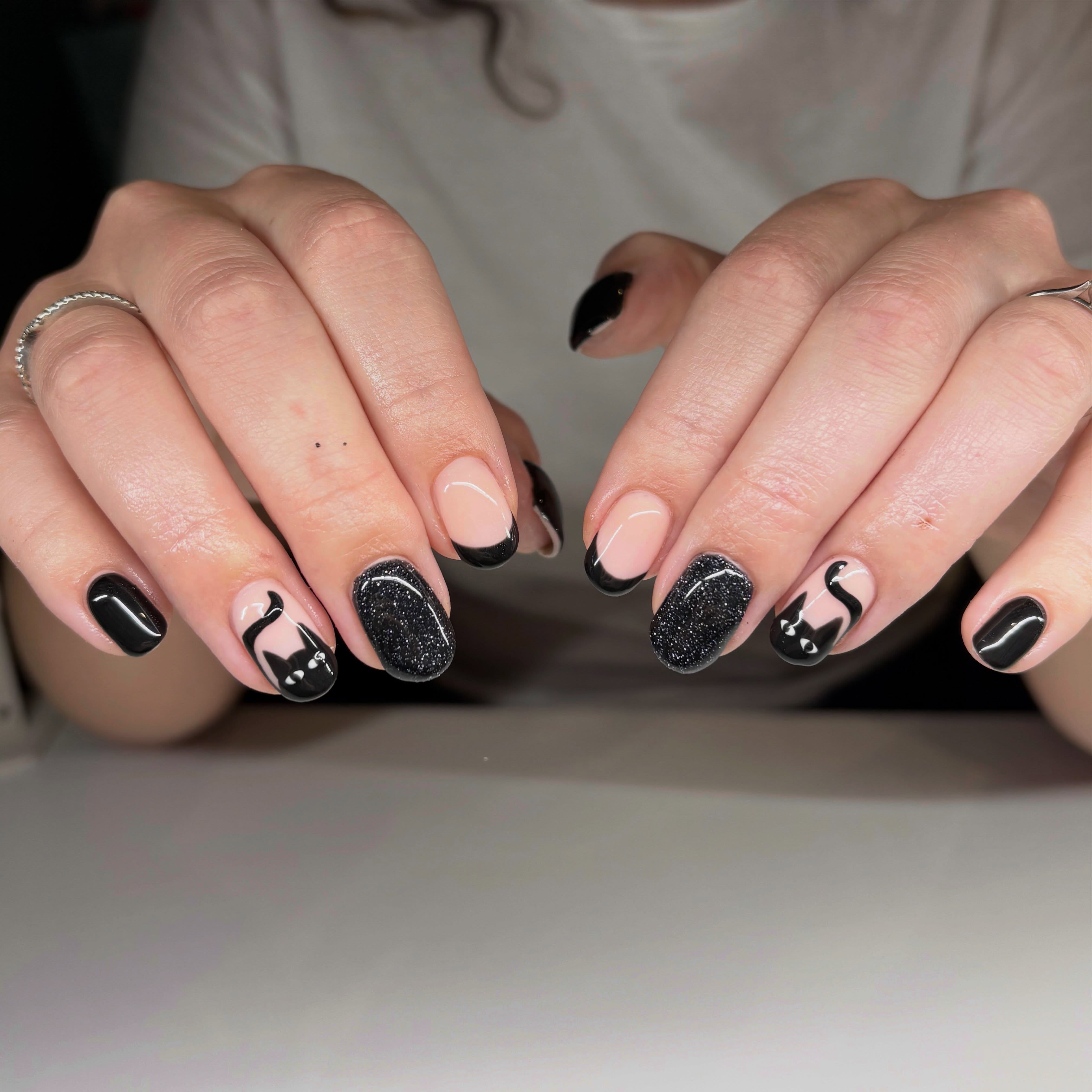 Black French tips, black cats and black glitter