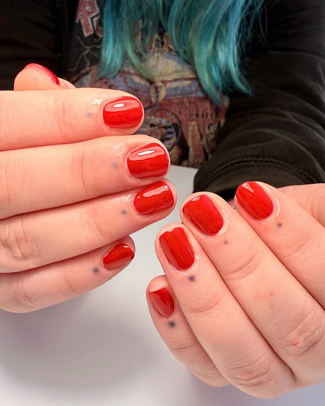 Short nails in glossy red gel